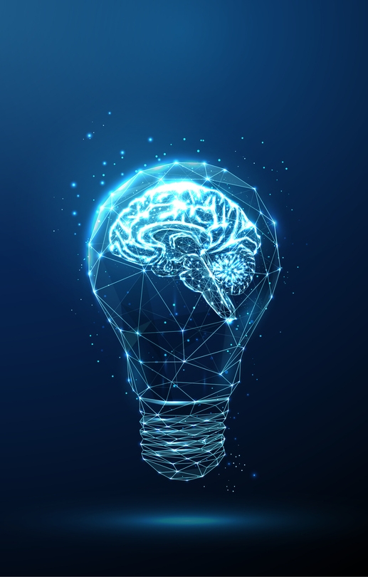 Brightly-lit light bulb against a dark background