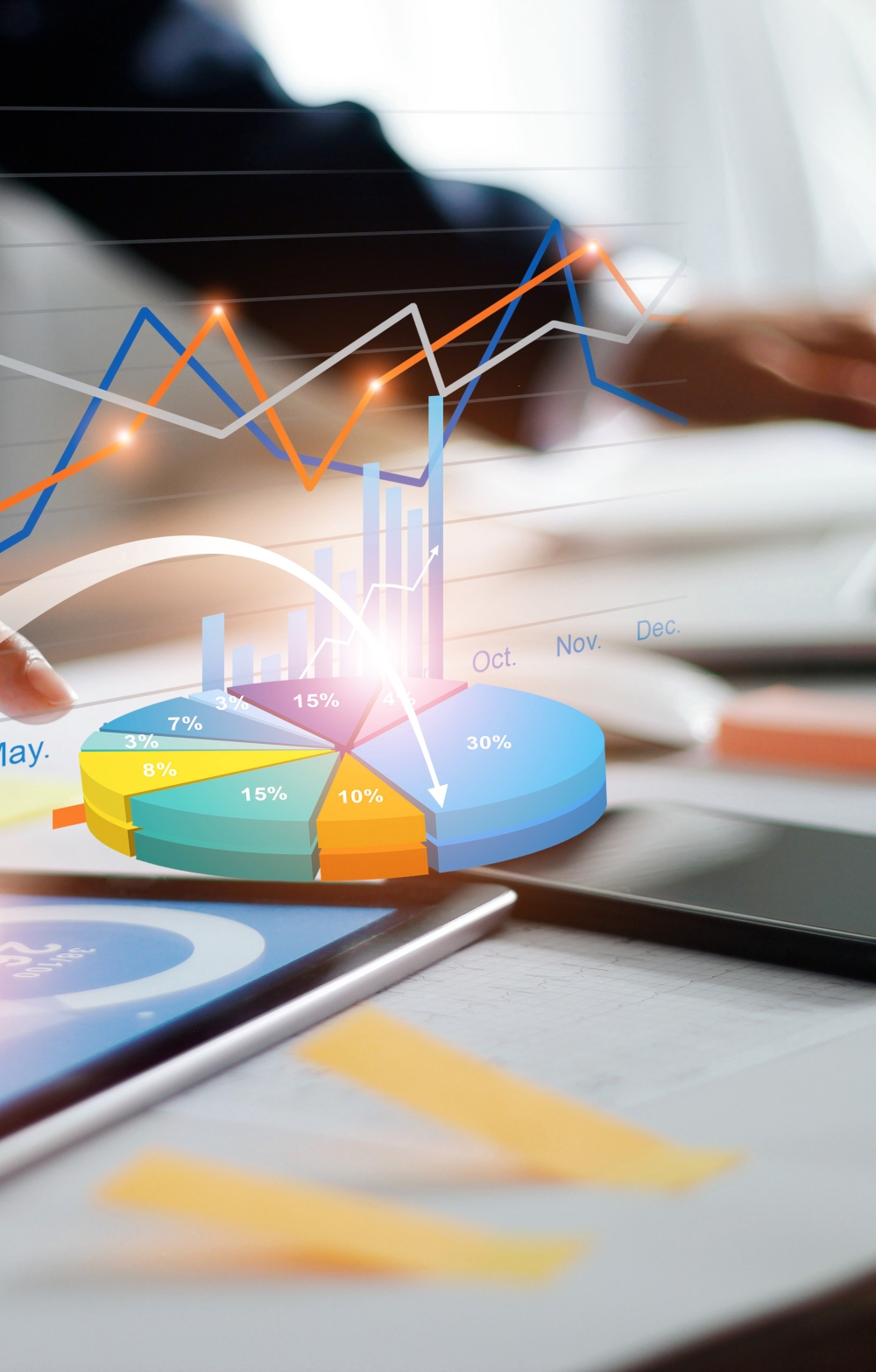 hands on a laptop keyboard against a statistical virtual background in colorful tones