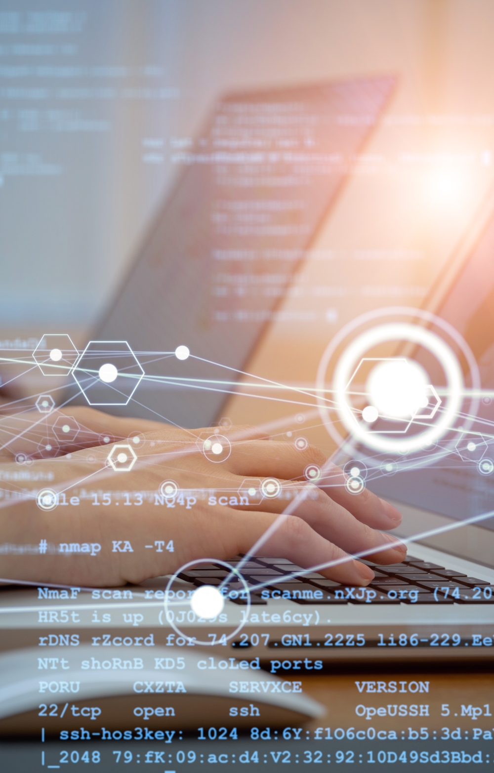 Hands on brightly coloured laptop keyboards with screens displaying statistical charts