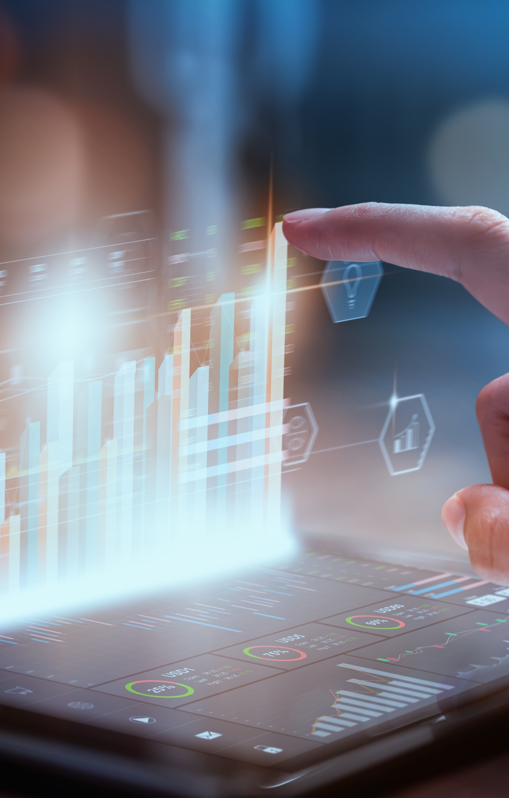 A finger pointing at the upward trend of a bar chart