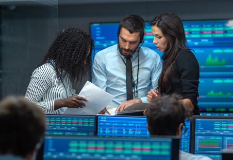 people talking on the stock exchange floor